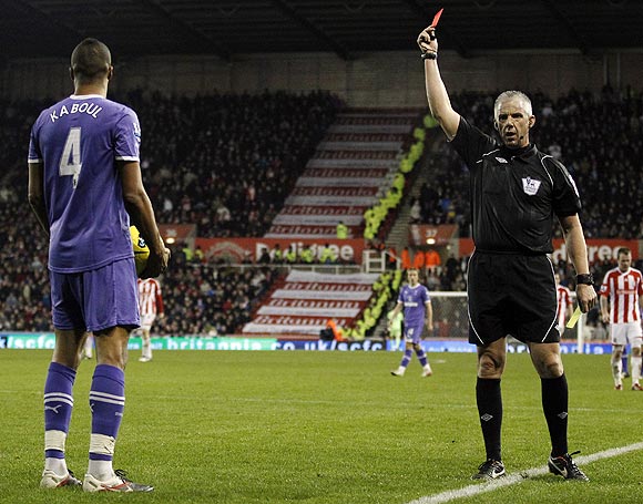 Tottenham Hotspur's Younes Kaboul (left) is sent off by referee Chris Foy