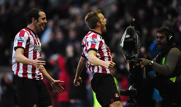 Sunderland goalscorer Sebastian Larsson (right) and John O'Shea celebrate the winning goal against Blackburn Rovers