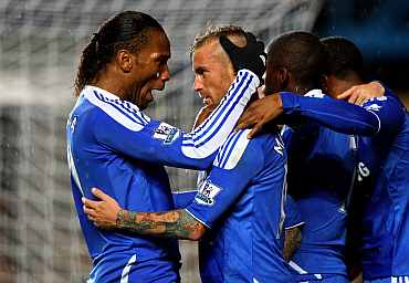 Raul Meireles celebrates with Didier Drogba after scoring a goal