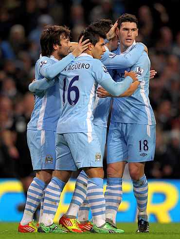 Manchester City's Sergio Auguero celebrates after scoring against Stoke City