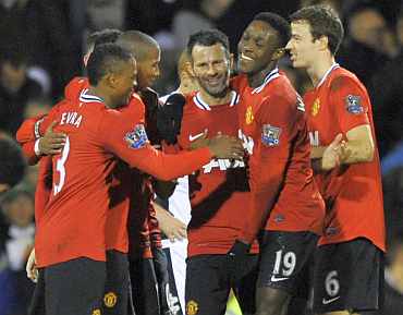 Manchester United's Ryan Giggs celebrates with teammates