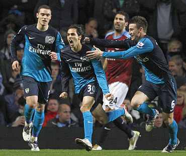 Arsenal's Yossi Benayoun celebrates after scoring