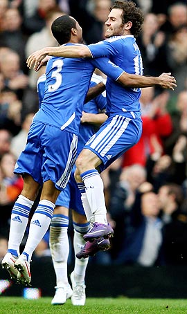 Juan Mata (right) of Chelsea celebrates with team-mate Ashley Cole (left) after scoring
