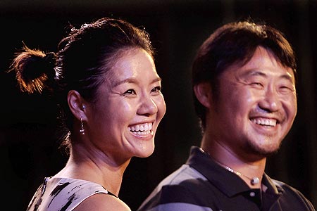 French Open champion Li Na (left) and her husband Jiang Shan