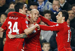 Liverpool's Raul Meireles (centre) celebrates with team-mates after scoring against Chelsea on Sunday