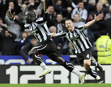Newcastle United's Cheik Tiote (left) celebrates scoring against Arsenal on Saturday