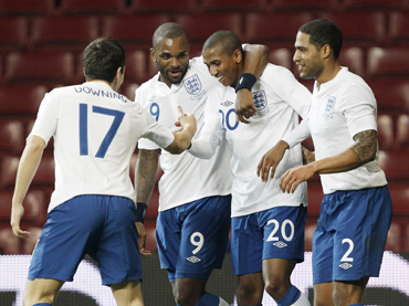 England 's Ashley Young (2nd R) celebrates after scoring against Denmark during their international friendly soccer match at the Parken Stadium, in Copenhagen