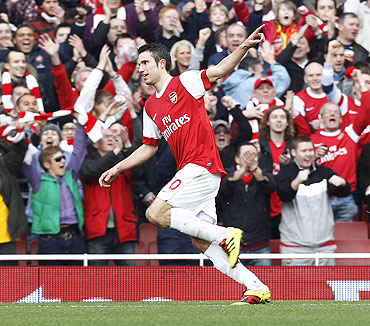Robin van Persie celebrates after scoring his first goal against Wolves on Saturday