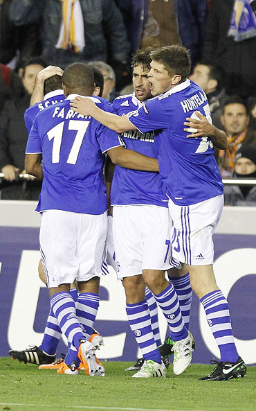 Schalke 04's Raul Gonzalez (centre) celebrates with teammates Klaas-Jan Huntelaar (right) and Jefferson Farfan after scoring against Valencia on Tuesday