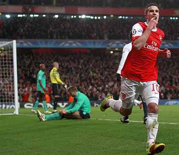 Arsenal's Robin van Persie celebrates after scoring against Barcelona during their Champions League match