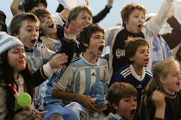 Children watching a match in Argentina.