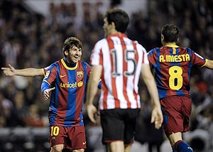 Barcelona's Lionel Messi (left) celebrates a goal with teammate Andres Iniesta during the King's Cup match in Bilbao on Wednesday