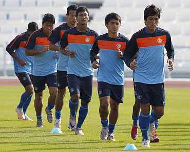 Indian players practice during a warmup session at Al Wakrah Stadium in Doha
