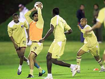 Qatar players play during a warm up session in Doha
