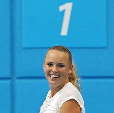 Caroline Wozniacki of Denmark smiles during a training session at Melbourne Park
