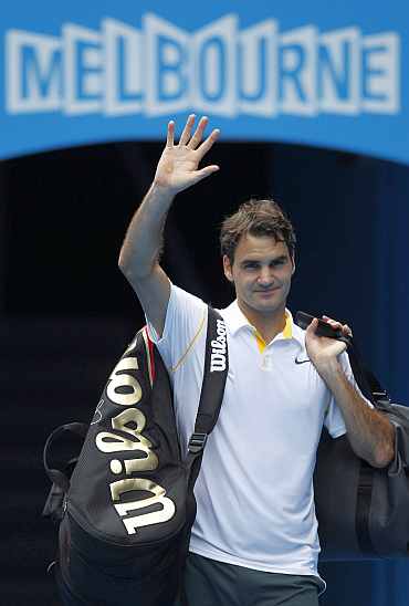 Roger Federer waves to the crowd after his match against Lacko at the Australian Open tournament in Melbourne