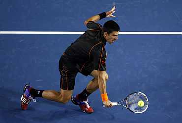 Novak Djokovic plays a volley at the Australian Open tennis tournament in Melbourne