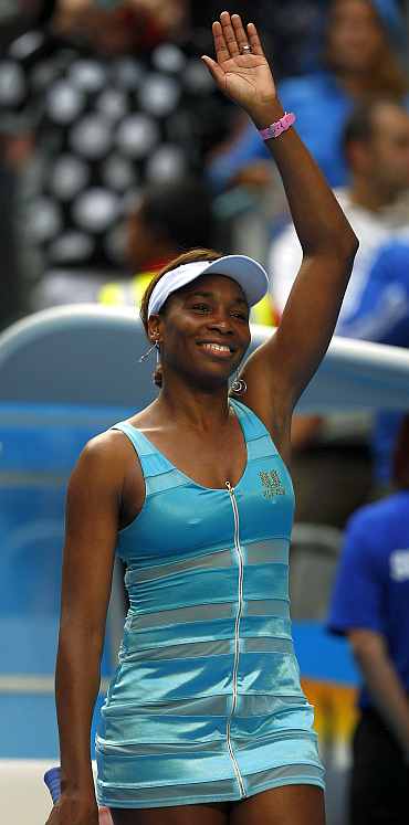 Venus Williams waves after winning her match at the Australian Open