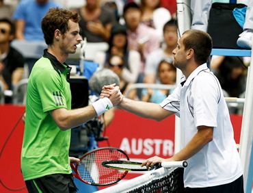 Andy Murray and Karol Beck shake hands after their match