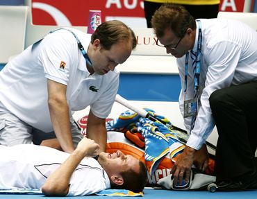 Beck receives medical treatment during his match against Murray