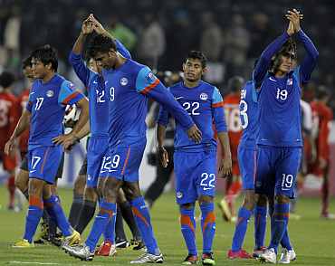 Indian players react after losing a match during the AFC Asian Cup in Doha