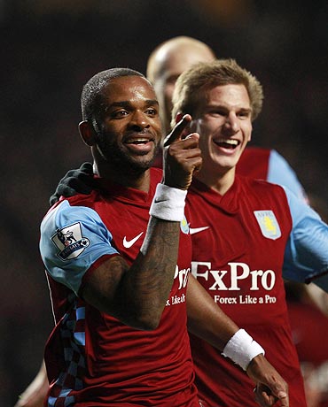 Aston Villa's Darren Bent (centre) celebrates with Marc Albrighton (left) and Stewart Downing after netting against Manchester City on Saturday
