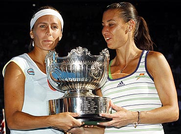 Gisela Dulko and Flavia Pennetta with the doubles trophy