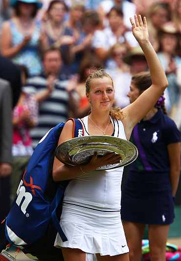 Petra Kvitova celebrates after winning her Ladies' final against Maria Sharapova on Day Twelve of the Wimbledon Lawn Tennis Championships