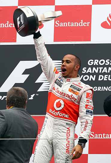 Lewis Hamilton celebrates after winning the German Grand Prix