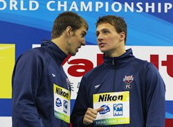 Gold medalist Ryan Lochte (R) talks with silver medalist Michael Phelps after the men's 200m Individual Medley final