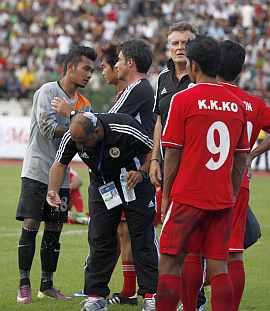 The Oman coach is hurt in stone throwing