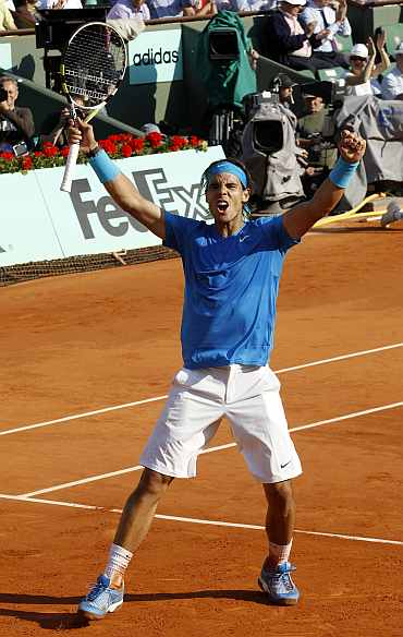 Rafa Nadal celebrates after winning his match against Robin Sodeling in Paris