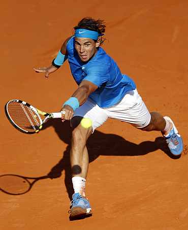 Rafa Nadal returns during his quarter-final match against Robin Soderling in Paris