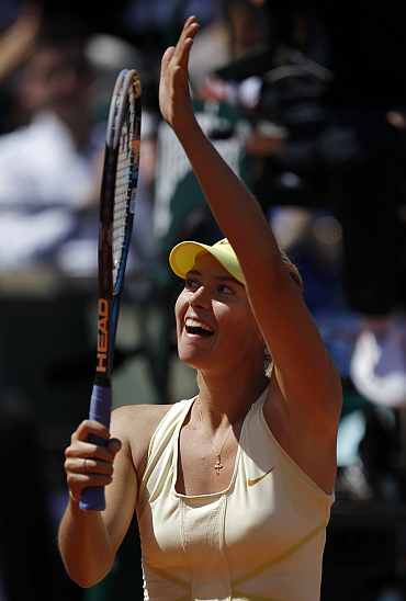 Maria Sharapova reacts after winning her match against Andrea Petkovic in Paris