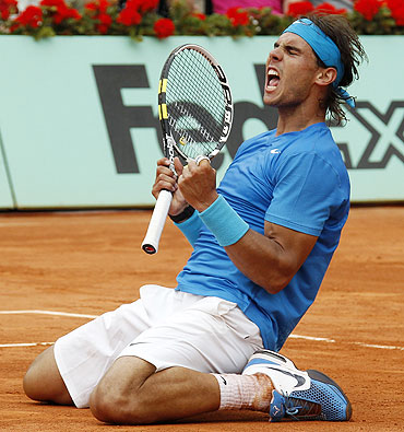 Rafael Nadal reacts after defeating Andy Murray