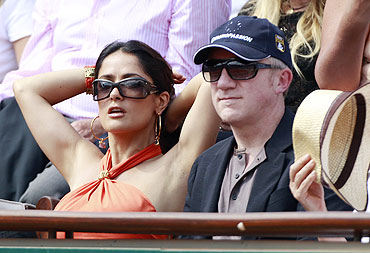 French businessman Francois-Henri Pinault and his actress wife Salma Hayek watch the semi-final match between Rafael Nadal and Andy Murray