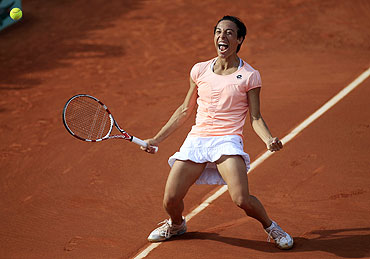 Francesca Schiavone of Italy reacts after winning her match against Jelena Jankovic of Serbia