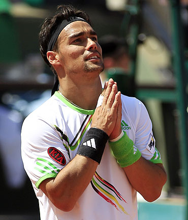 Fabio Fognini of Italy reacts after winning his match against Albert Montanes of Spain