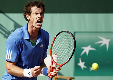 Andy Murray reacts in the match against Triocki