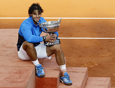 Rafael Nadal poses with the trophy