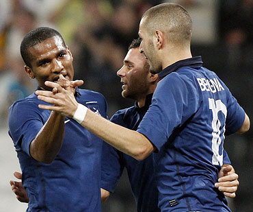 France's Marvin Martin (centre), Florent Malouda (left) and Karim Benzema celebrate after beating Ukarine in an international friendly on Monday