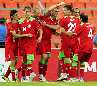 Belarus' Sergei Kornilenko (centre) celebrates with teammates after scoring against Luxemburg