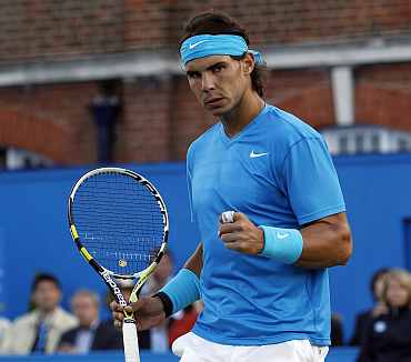 Rafa Nadal reacts after winning his match against Matthew Ebden at the Queen's Club championships