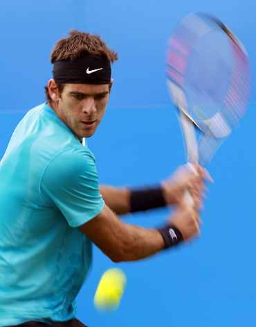Juan del Potro returns during a practice match at the Queen's Club Championships