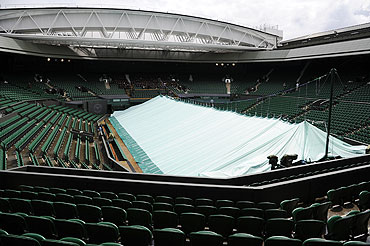 The covers pulled across Centre Court during rainy weather on Sunday
