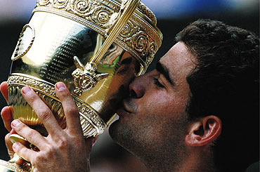 Pete Sampras kisses the trophy after winning the 1997 Wimbledon crown