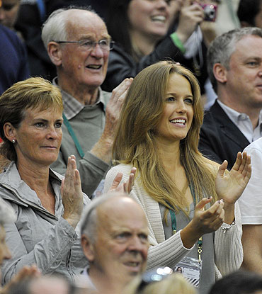 Andy Murray's mother Judy Murray (left), and his girlfriend Kim Sears (centre) applaud after the Briton defeated Daniel Gimeno-Traver
