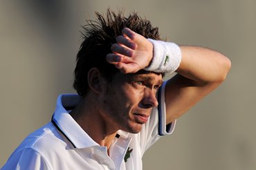 Mahut reacts during the match