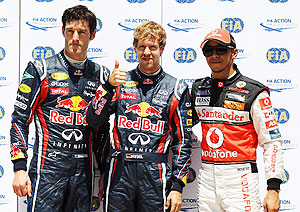 Pole sitter Sebastian Vettel (centre) second placed Mark Webber (left) and third placed Lewis Hamilton celebrate after qualifying for the European Formula One Grand Prix in Valencia, Spain on Saturday
