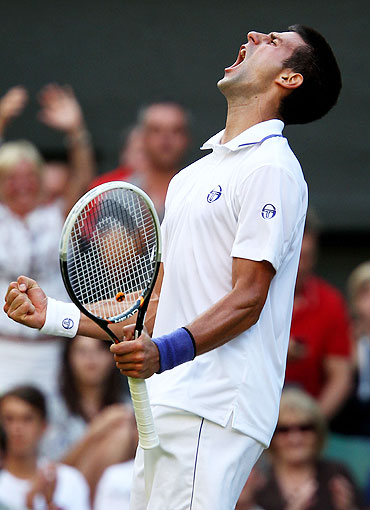 Novak Djokovic celebrates after beating Marcos Baghdatis on Saturday